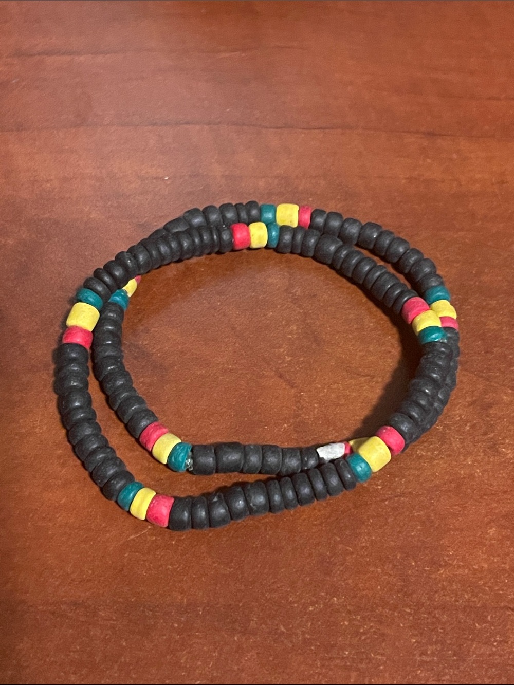 Beaded Stretch Bracelet with Black, Red, Yellow, Green Accents